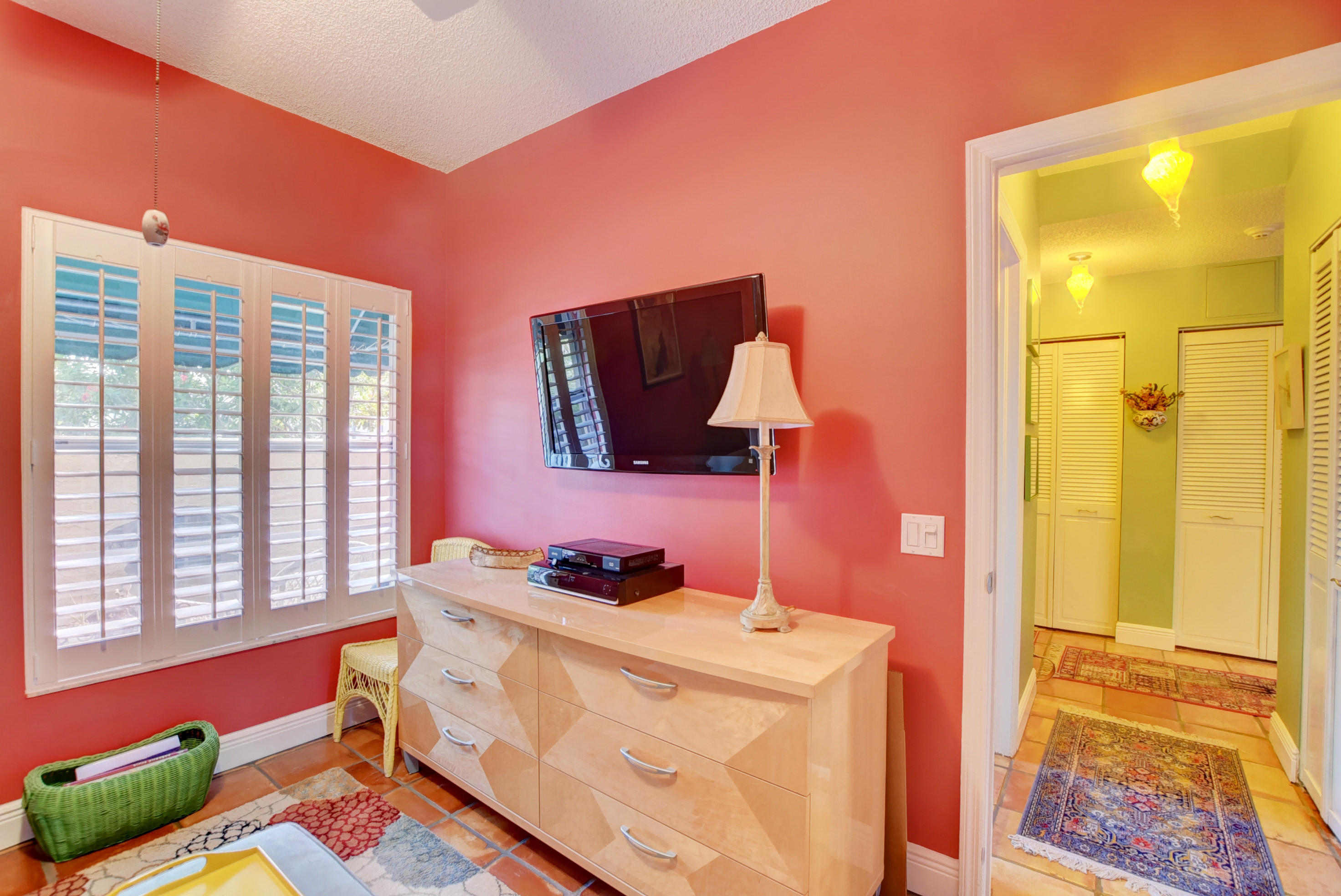 6660 Via Regina Boca Raton, FL 33433 - Photo 23 of 28 a bedroom with a bed and wooden floor