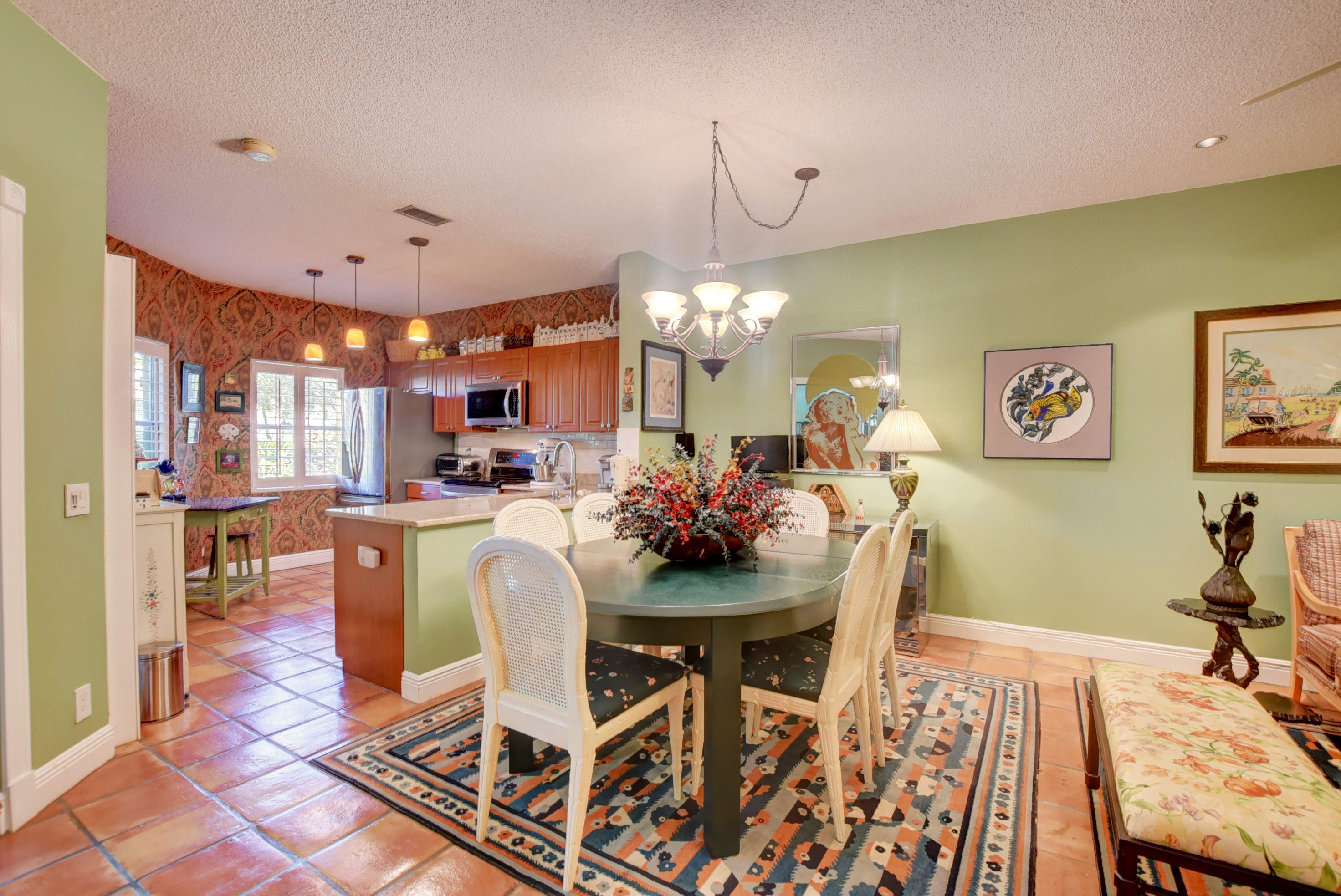6660 Via Regina Boca Raton, FL 33433 - Photo 7 of 28 a view of a dining room with furniture and chandelier