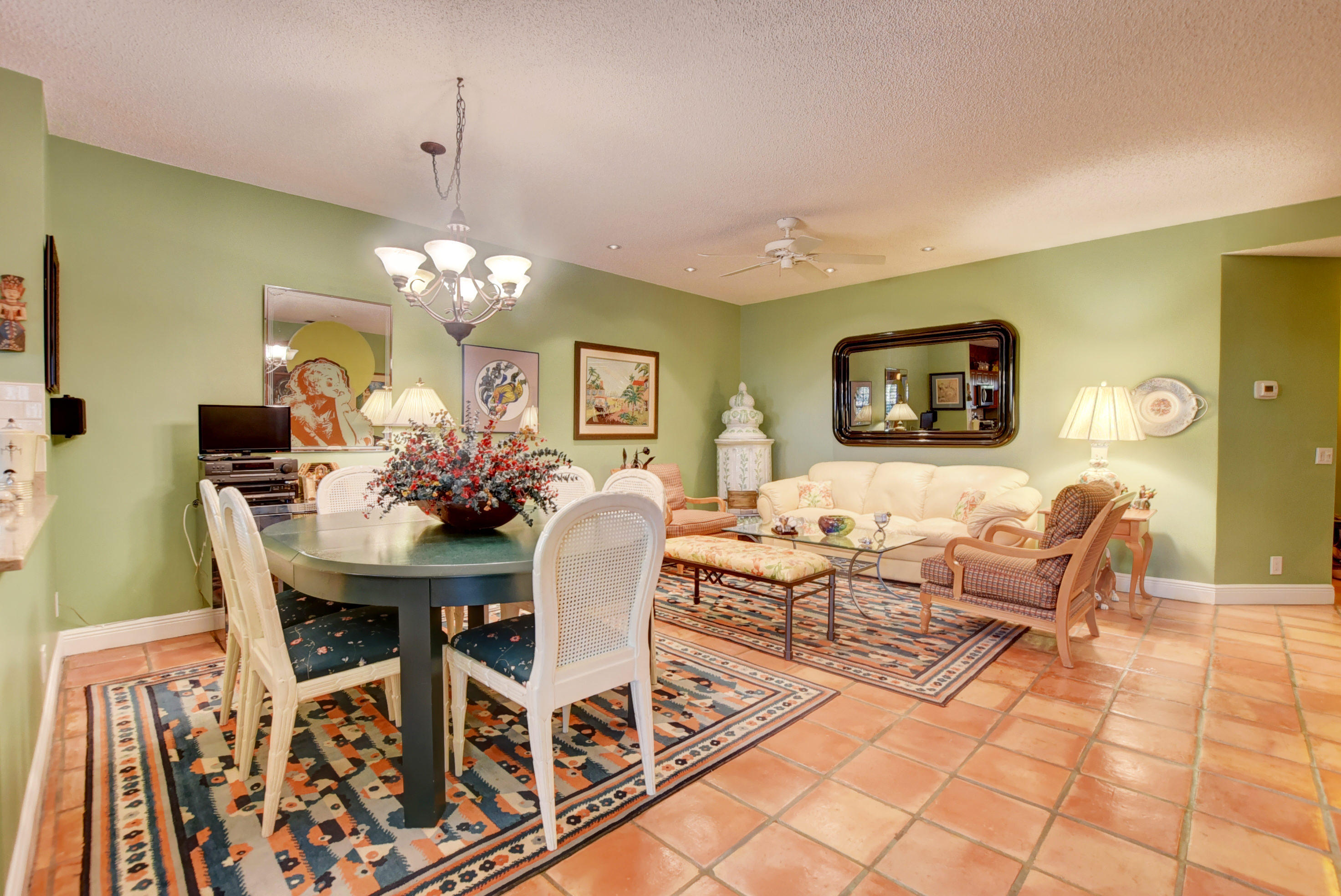 6660 Via Regina Boca Raton, FL 33433 - Photo 10 of 28 a living room with furniture a chandelier and a dining table