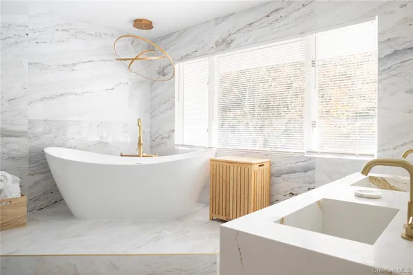 a white bath tub sitting in a bathroom