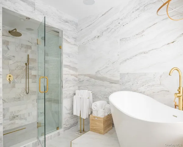 a bathroom with a bathtub and shower