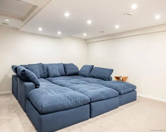 a living room with a couch and cabinets