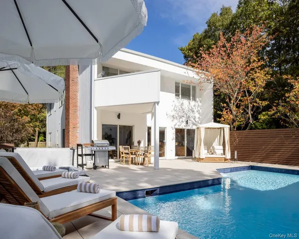 a view of a patio with couches table and chairs