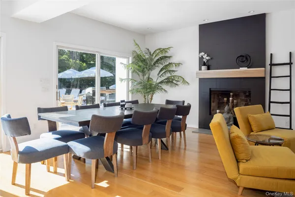 a dining room with furniture window and outdoor view