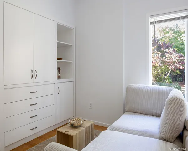 a living room with furniture and window