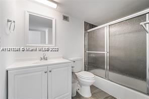 4101 Pine Tree Drive, Unit 319 Miami Beach, FL 33140 - Photo 8 of 12 a bathroom with a shower a toilet and a sink