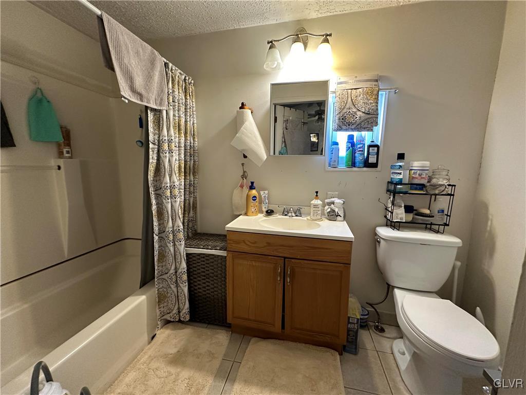 513 Norman Road Nazareth, PA 18064 - Photo 12 of 20 a bathroom with a toilet sink and mirror