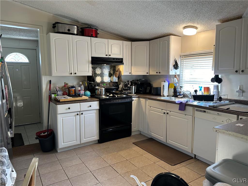 513 Norman Road Nazareth, PA 18064 - Photo 5 of 20 a kitchen with a sink cabinets and stainless steel appliances