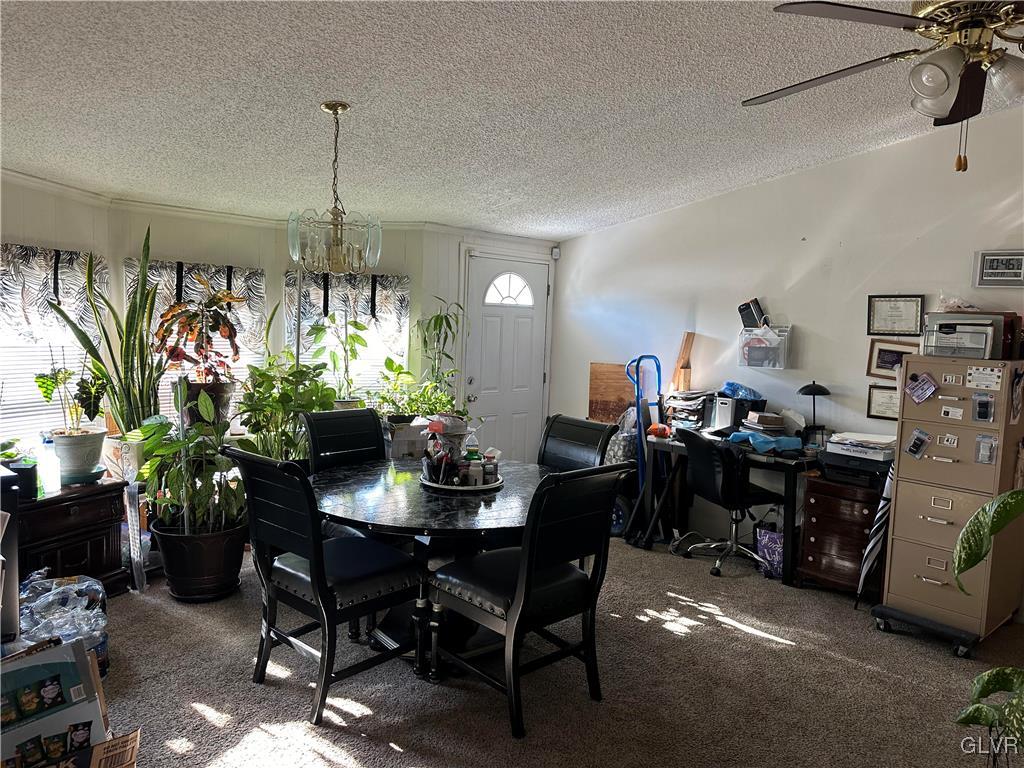 513 Norman Road Nazareth, PA 18064 - Photo 6 of 20 a view of a dining room and livingroom with furniture wooden floor a chandelier
