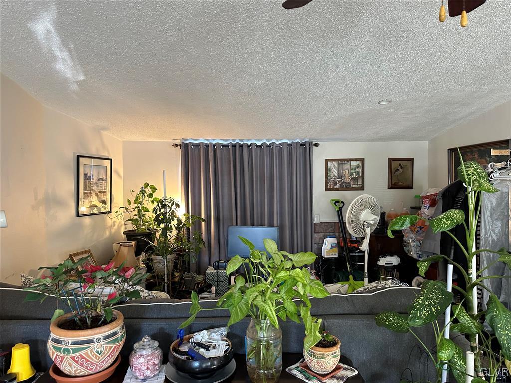 513 Norman Road Nazareth, PA 18064 - Photo 8 of 20 a room with furniture flowers and flowers