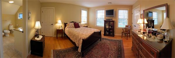 325 Leverett Road Amherst, MA 01002 - Photo 22 of 30 a bed room with a bed and a chandelier
