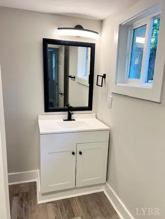 a white toilet sitting in a bathroom and a sink