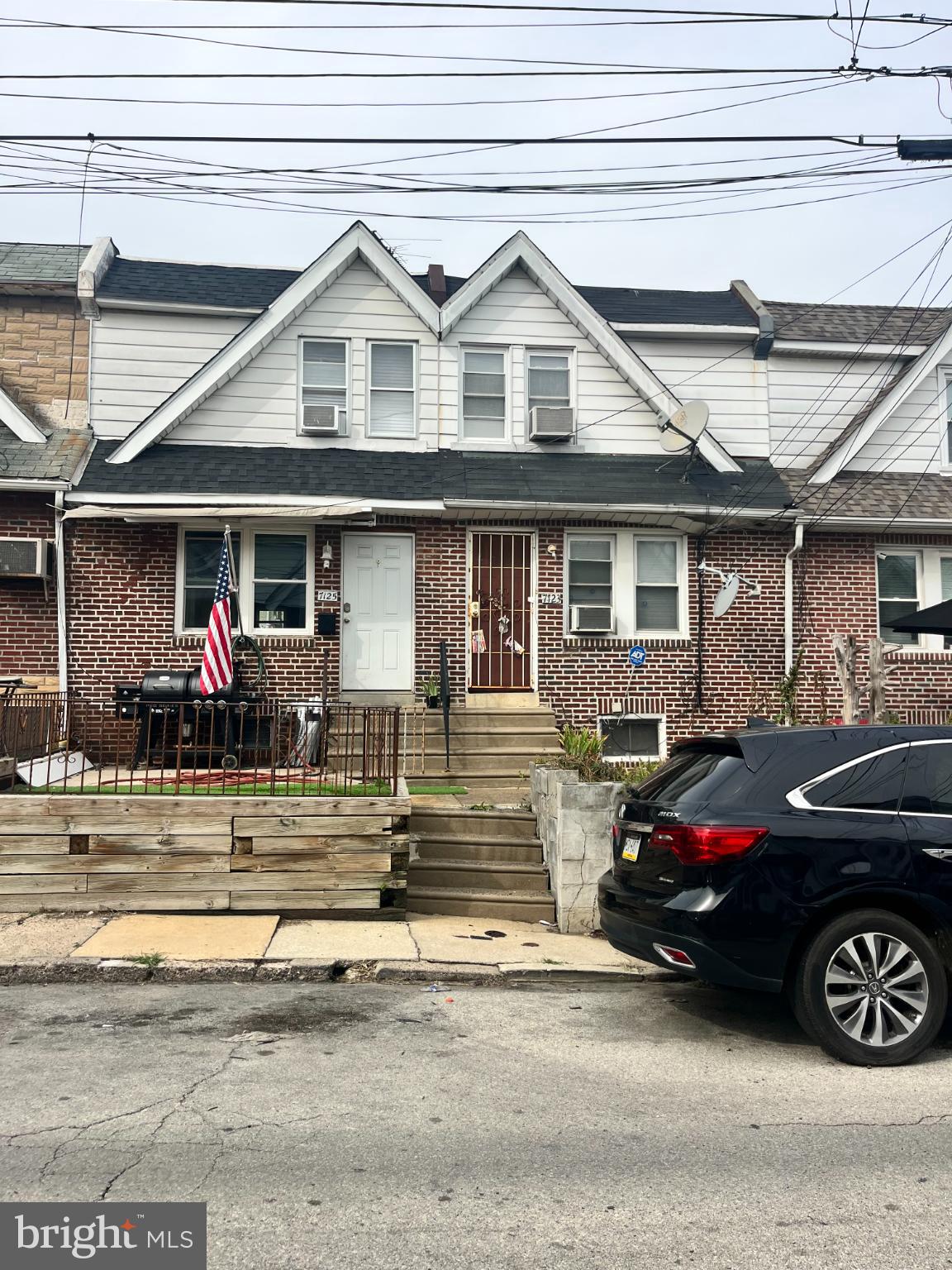 7123 Seaford Road Upper Darby, PA 19082 - Photo 1 of 6 a front view of a house with lots of cars parked