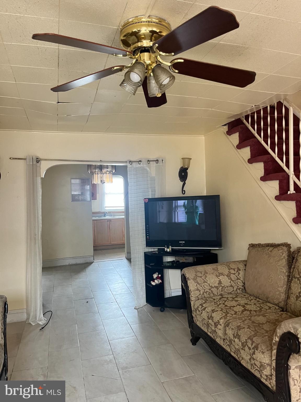 7123 Seaford Road Upper Darby, PA 19082 - Photo 2 of 6 a living room with furniture and a flat screen tv