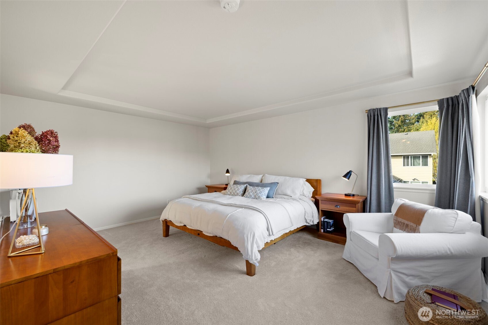 12058 Concord Way Mukilteo, WA 98275 - Photo 16 of 31 a spacious bedroom with a bed and a couch