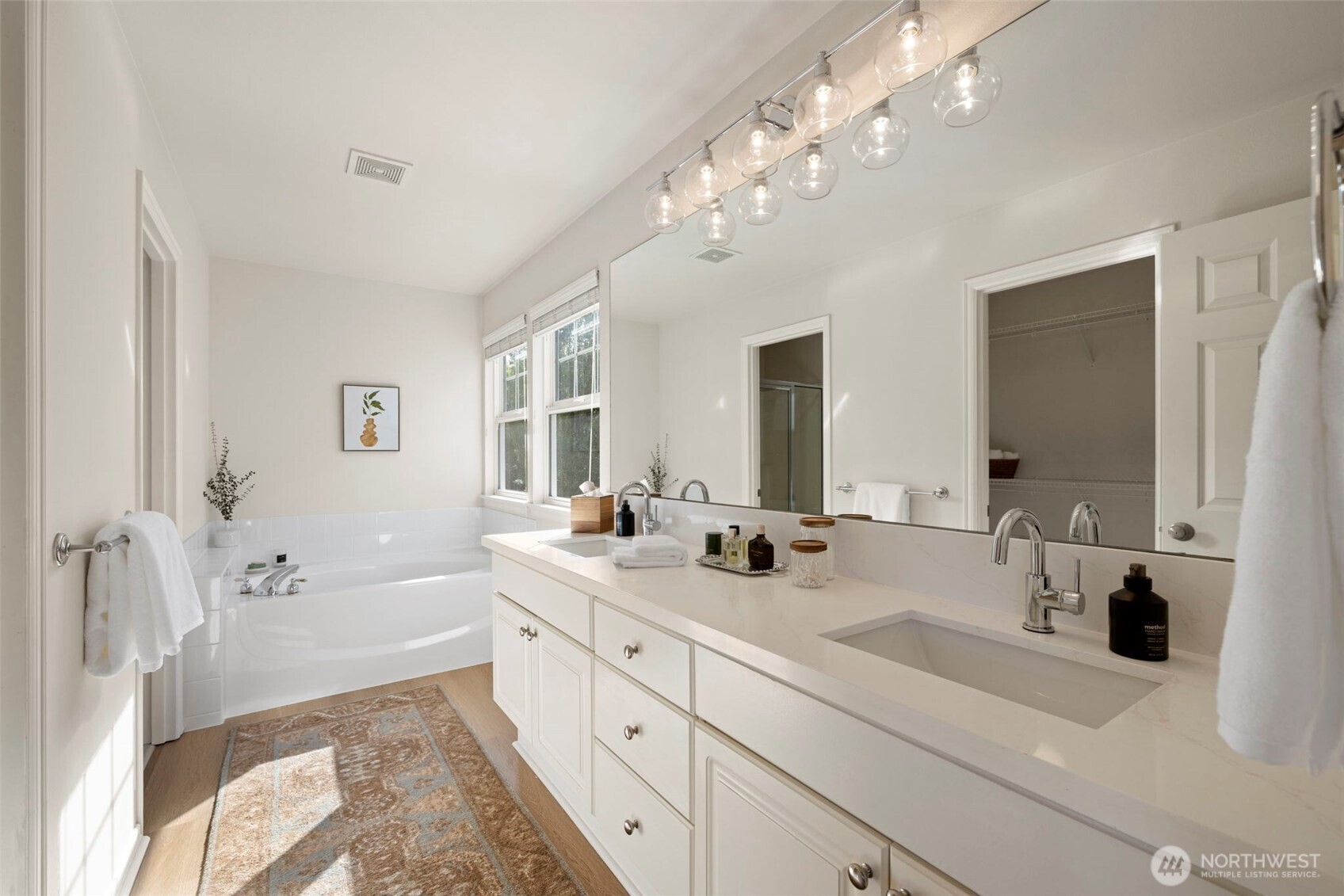 12058 Concord Way Mukilteo, WA 98275 - Photo 18 of 31 a spacious bathroom with a double vanity sink mirror and bathtub