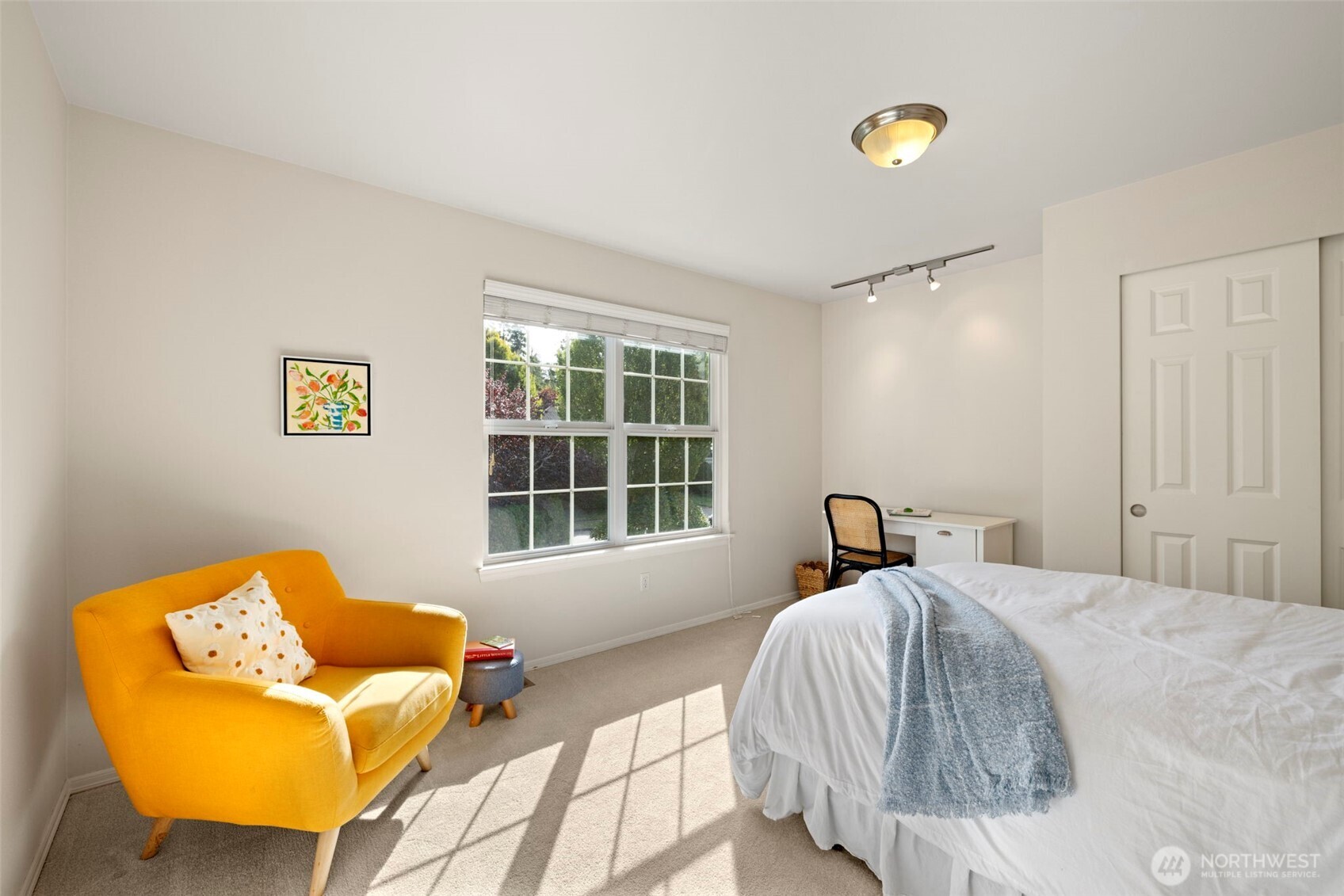 12058 Concord Way Mukilteo, WA 98275 - Photo 21 of 31 a bedroom with a bed and window