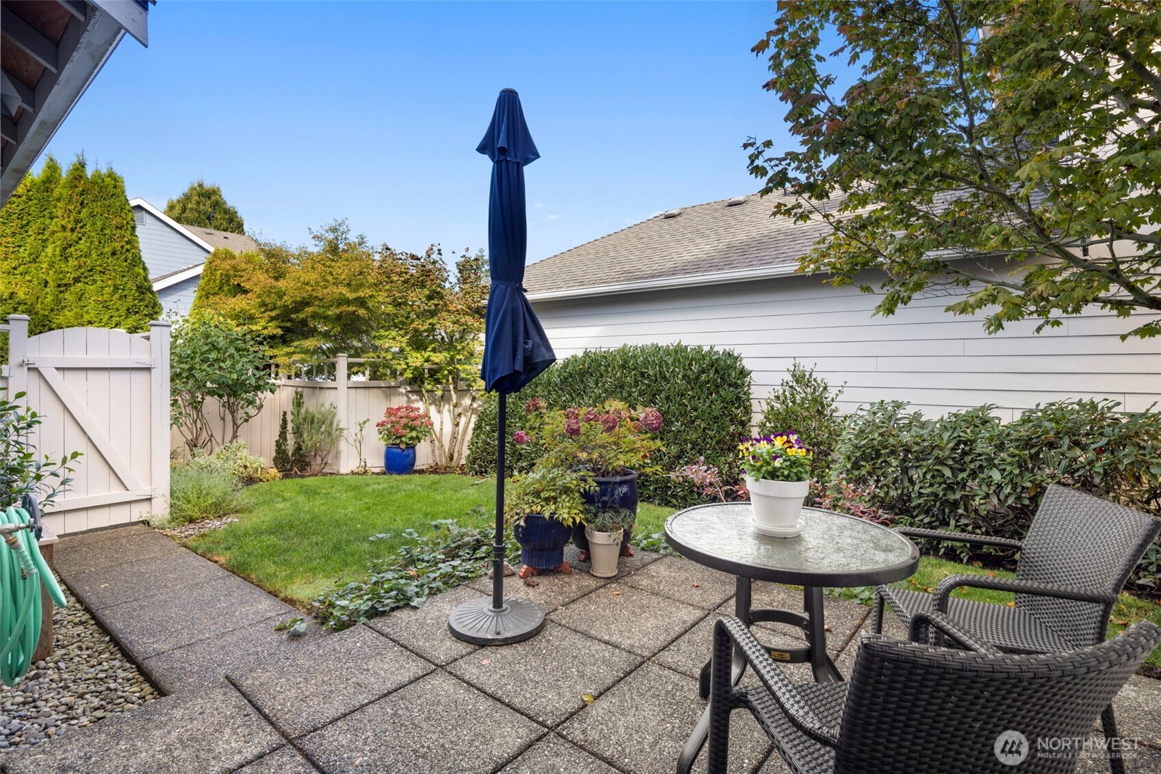 12058 Concord Way Mukilteo, WA 98275 - Photo 27 of 31 a view of a patio with table and chairs and a potted plants
