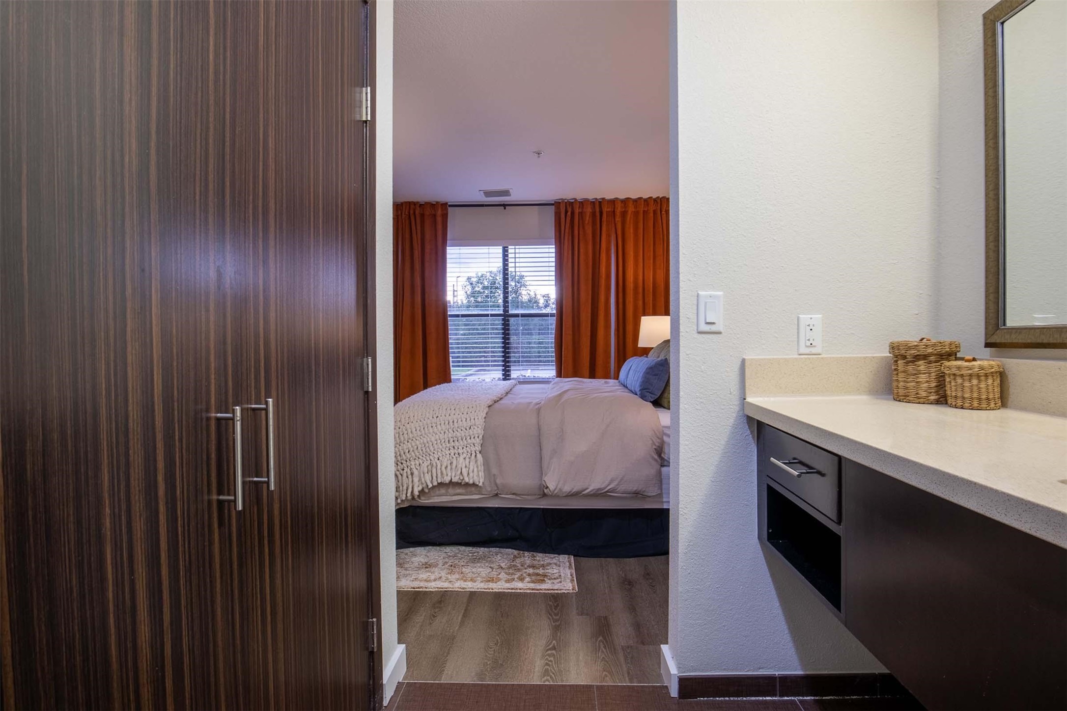 18828 Highway 249, Unit 201 Houston, TX 77070 - Photo 16 of 49 a en suite bathroom with a granite countertop sink and a mirror