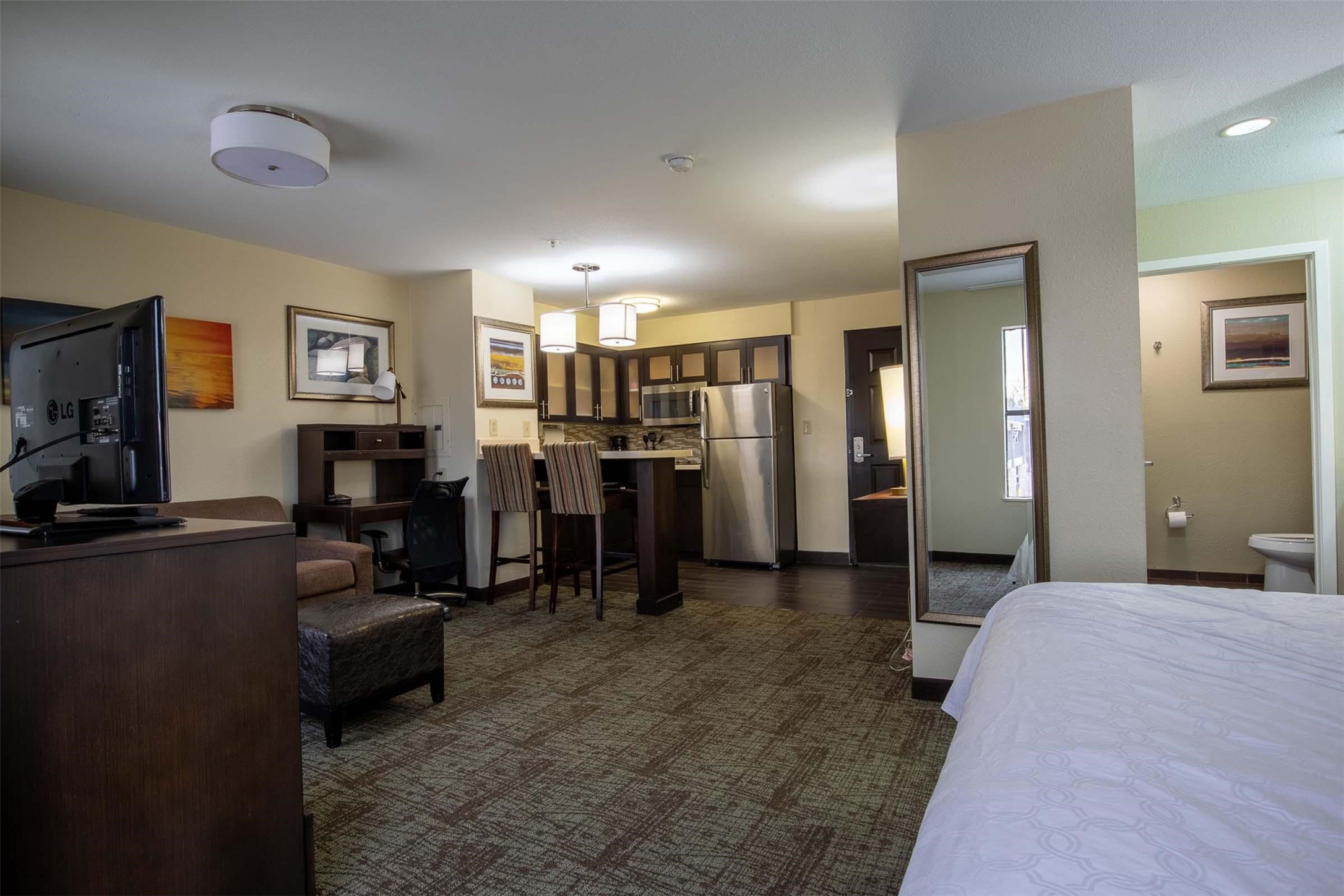 18828 Highway 249, Unit 201 Houston, TX 77070 - Photo 26 of 49 a bedroom with furniture and a flat screen tv