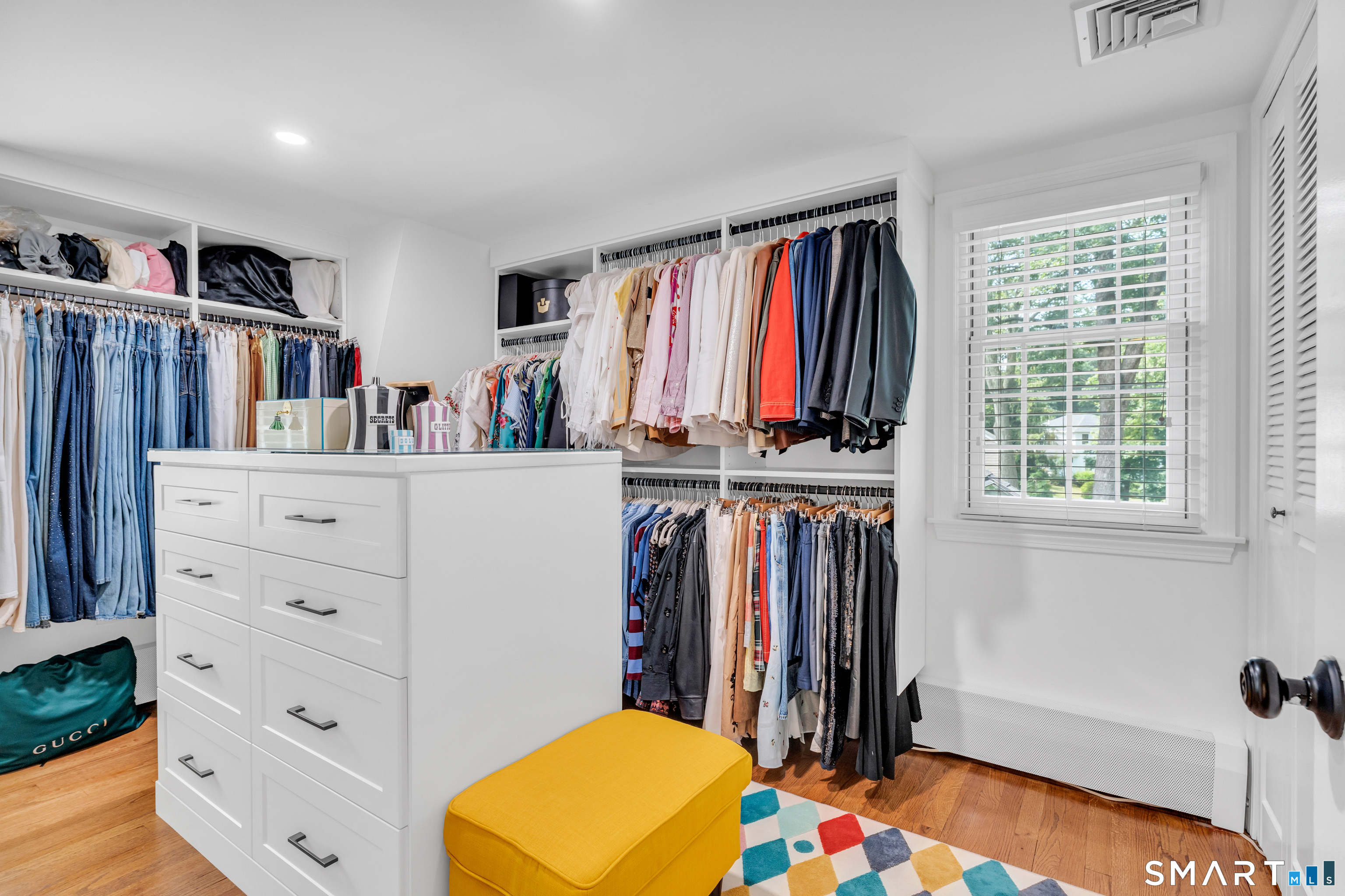 33 River Edge Farms Road Madison, CT 06443 - Photo 25 of 40 Currently curated as a luxurious dressing room, this flexible space can easily transition into a third bedroom to suit your needs.