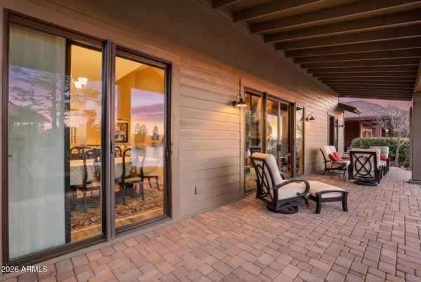 a view of a backyard with sitting area