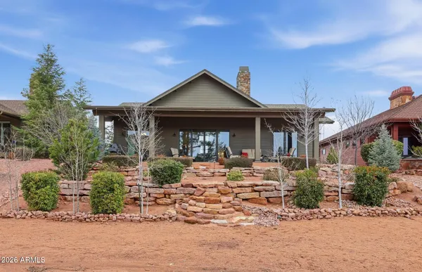 a view of a lake with a tree in the background