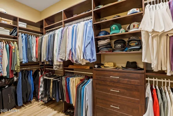 a view of living room kitchen with furniture and a chandelier
