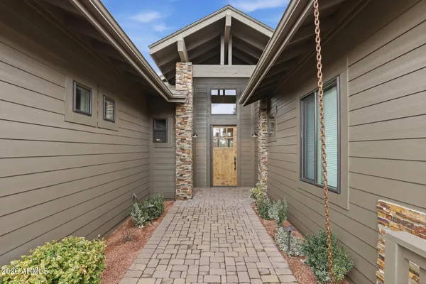 a view of a pathway along the house