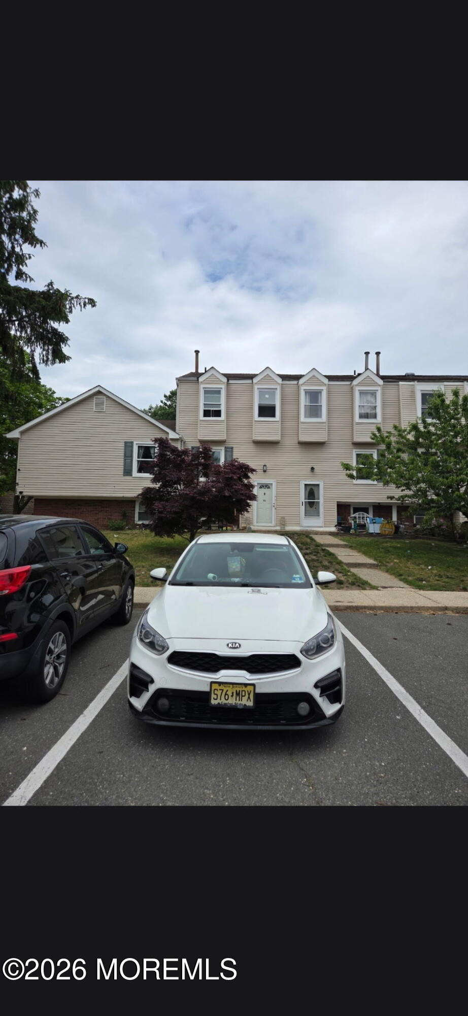166 Sawmill Road, Unit 563 Brick, NJ 08724 - Photo 13 of 14 a car parked in the middle of a city