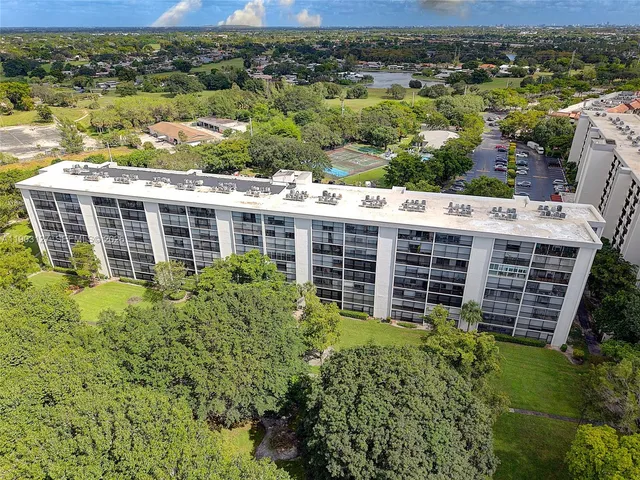 a front view of a building with garden