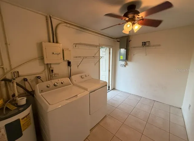 a utility room with dryer and washer