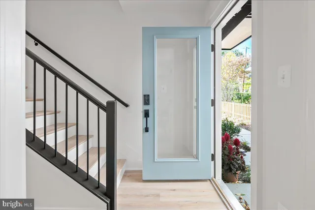 a view of living room filled with furniture and a potted plant