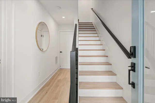 a bathroom with a toilet sink shower and mirror