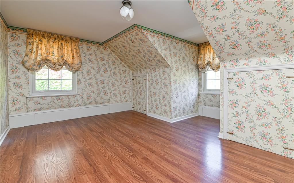 2065 Fairhill Road Sewickley, PA 15143 - Photo 13 of 45 an empty room with wooden floor and windows