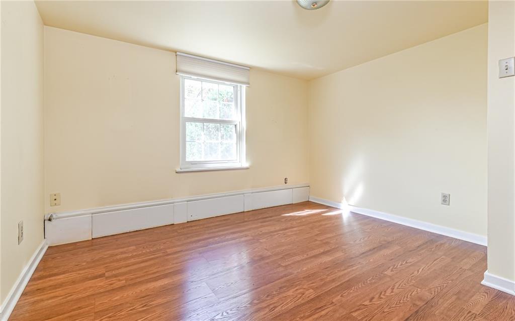 2065 Fairhill Road Sewickley, PA 15143 - Photo 16 of 45 an empty room with wooden floor and windows