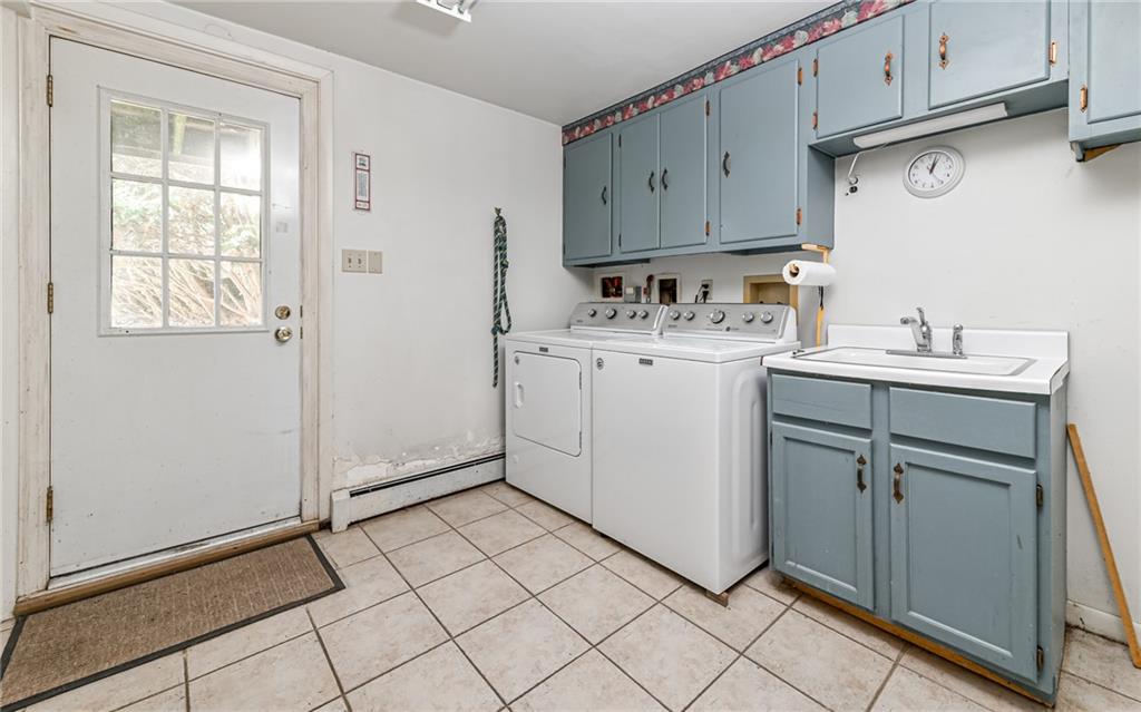 2065 Fairhill Road Sewickley, PA 15143 - Photo 23 of 45 a view of cabinets a sink and a stove in a kitchen