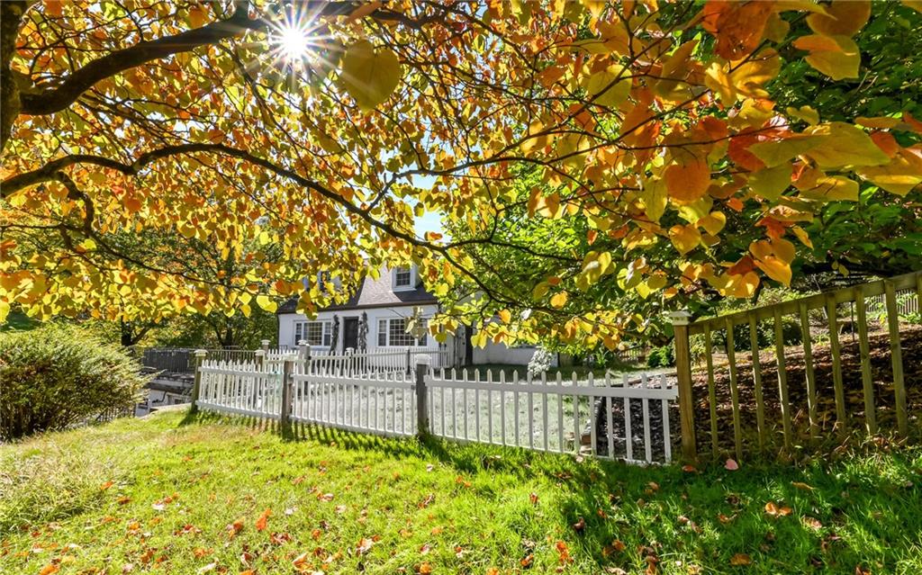 2065 Fairhill Road Sewickley, PA 15143 - Photo 25 of 45 a view of backyard with white house and wooden fence