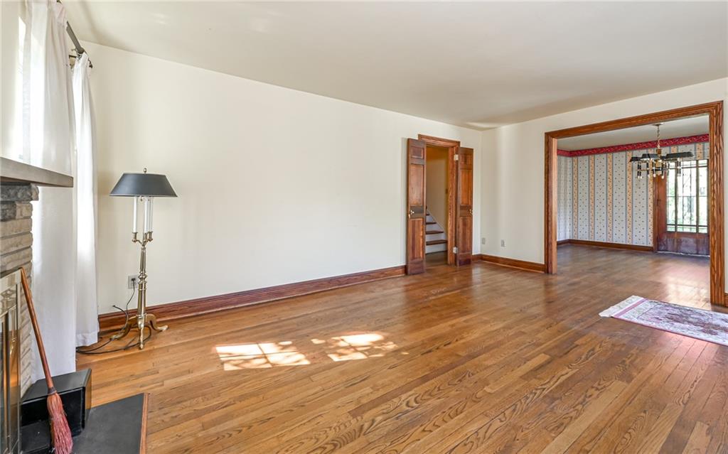 2065 Fairhill Road Sewickley, PA 15143 - Photo 8 of 45 a view of an empty room with wooden floor and a window