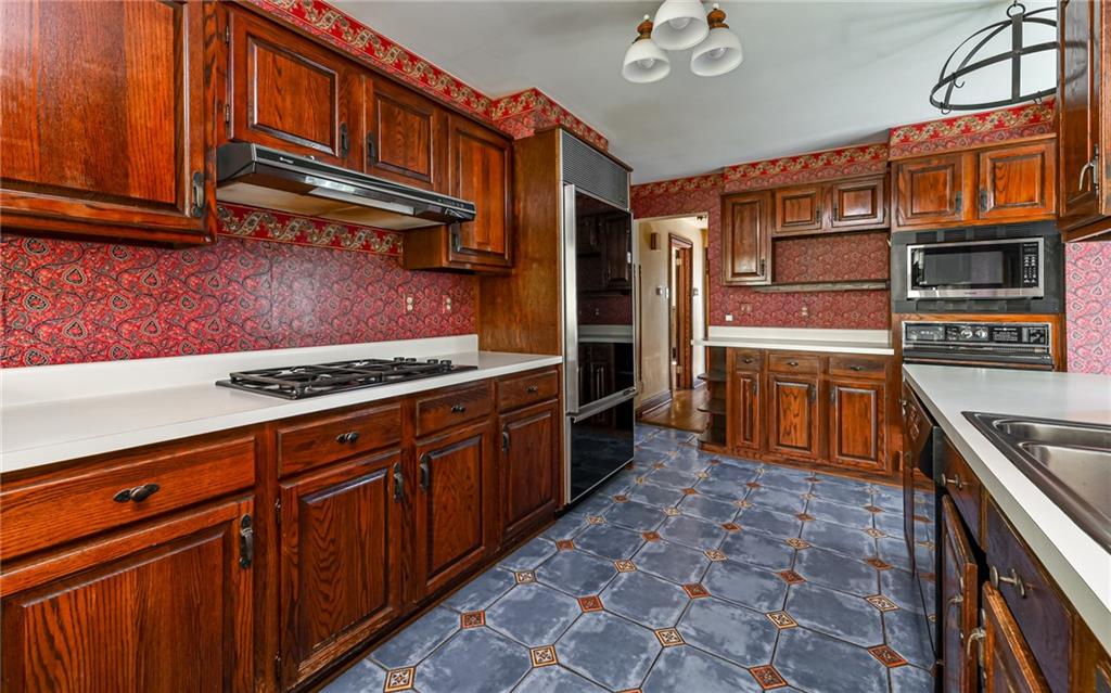 2065 Fairhill Road Sewickley, PA 15143 - Photo 10 of 45 a kitchen with stainless steel appliances granite countertop a stove and cabinets