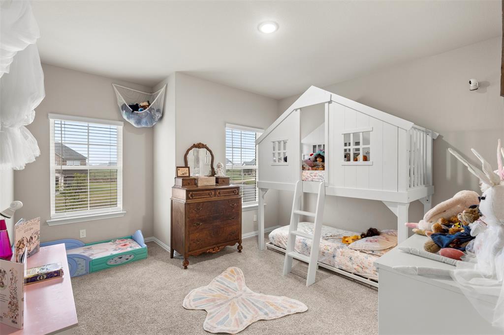 107 Yampa Court Rhome, TX 76078 - Photo 15 of 30 Carpeted room with a vaulted ceiling and recessed lighting