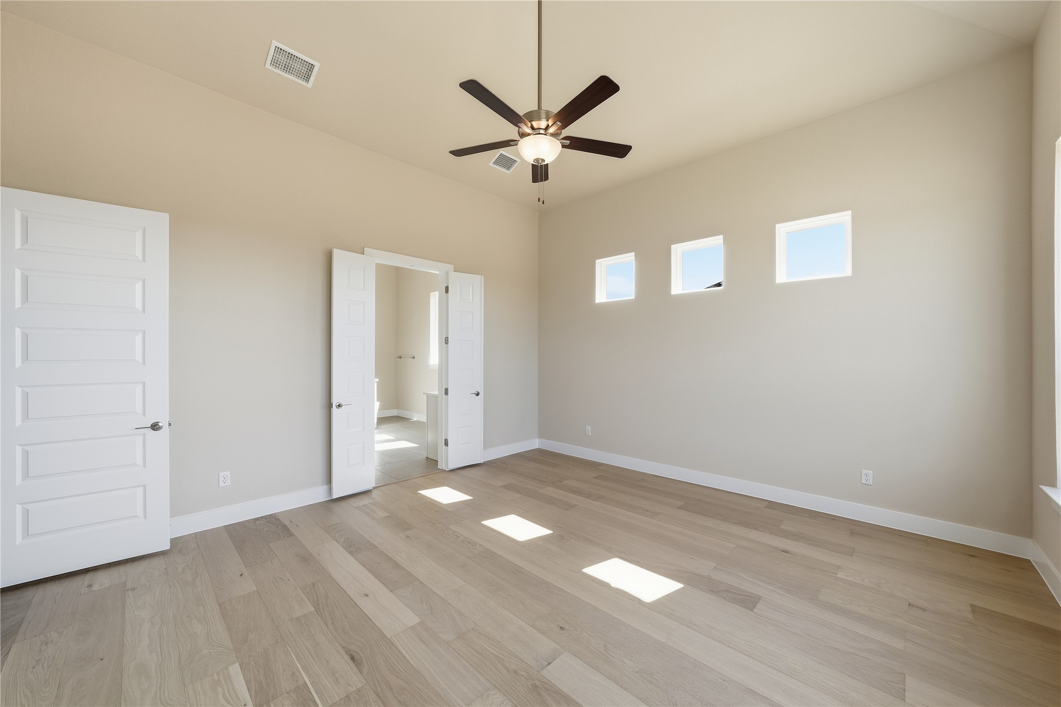 1209 Doelling Drive Georgetown, TX 78633 - Photo 12 of 31 Unfurnished bedroom with ceiling fan and light wood finished floors