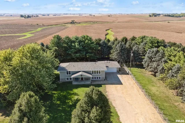 an aerial view of a house with swimming pool