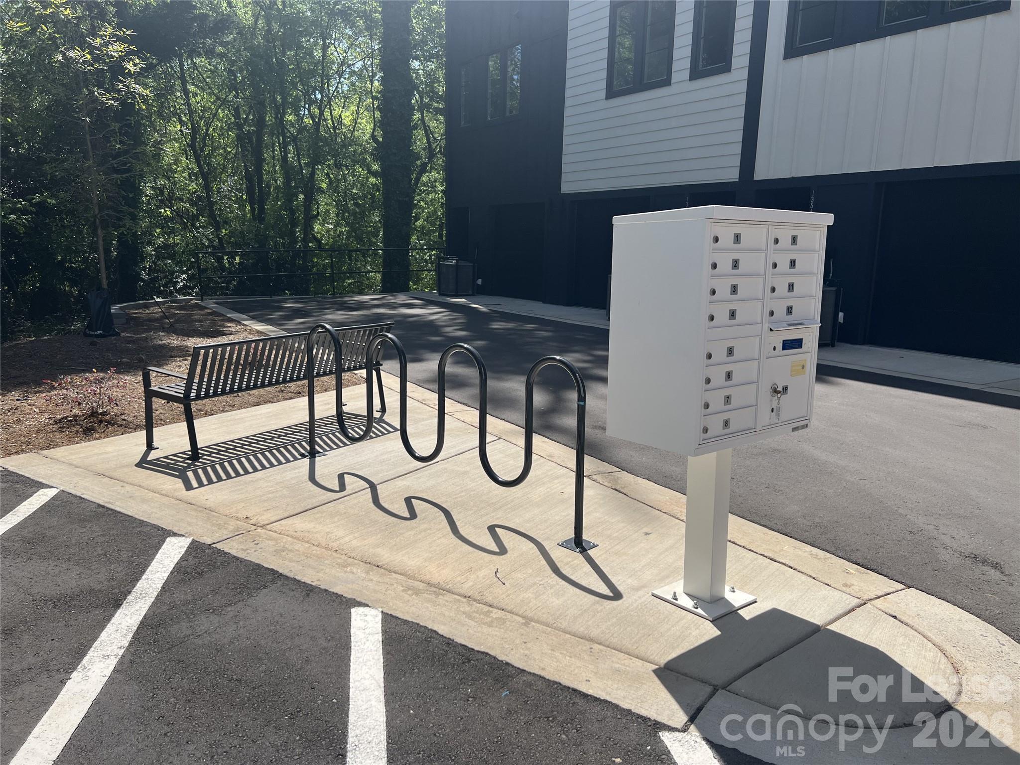 1356 Briar Creek Road Charlotte, NC 28205 - Photo 14 of 15 a bench on the roof of a building