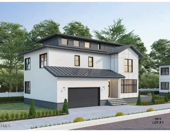 a front view of a house with a garden and garage