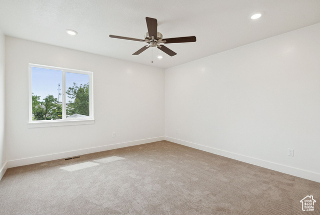 1615 North Angel Street, Unit I Layton, UT 84041 - Photo 31 of 56 Unfurnished room featuring light carpet, recessed lighting, and a ceiling fan