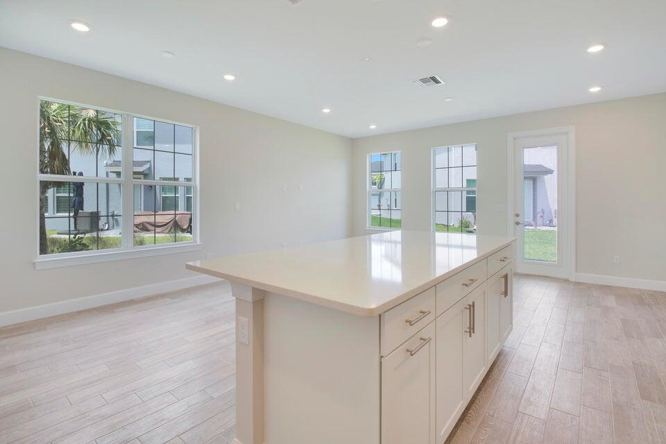 1875 Southeast Ocean Cove Way Stuart, FL 34996 - Photo 11 of 37 a kitchen with counter top space cabinets and window