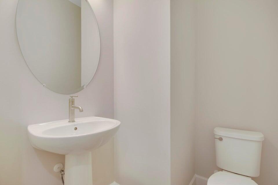 1875 Southeast Ocean Cove Way Stuart, FL 34996 - Photo 19 of 37 a bathroom with a sink and a mirror