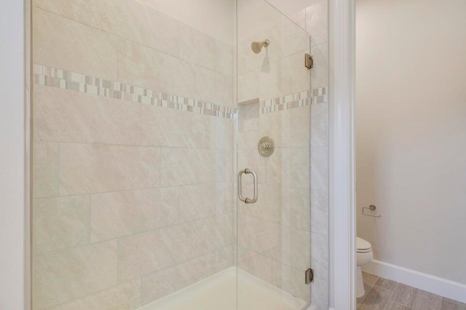 1875 Southeast Ocean Cove Way Stuart, FL 34996 - Photo 28 of 37 a bathroom with a shower