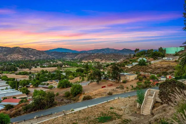 a view of a city with mountains in the background